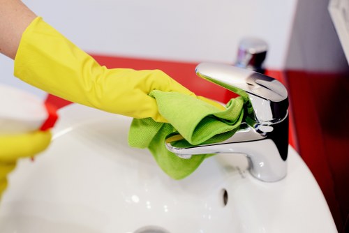 Cleaner removing fine construction dust during after builders cleaning in W4